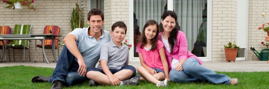 Family in front of their home